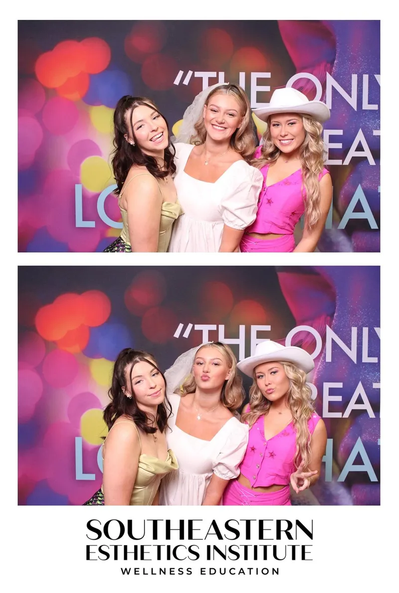 Three women posing at a branded corporate event